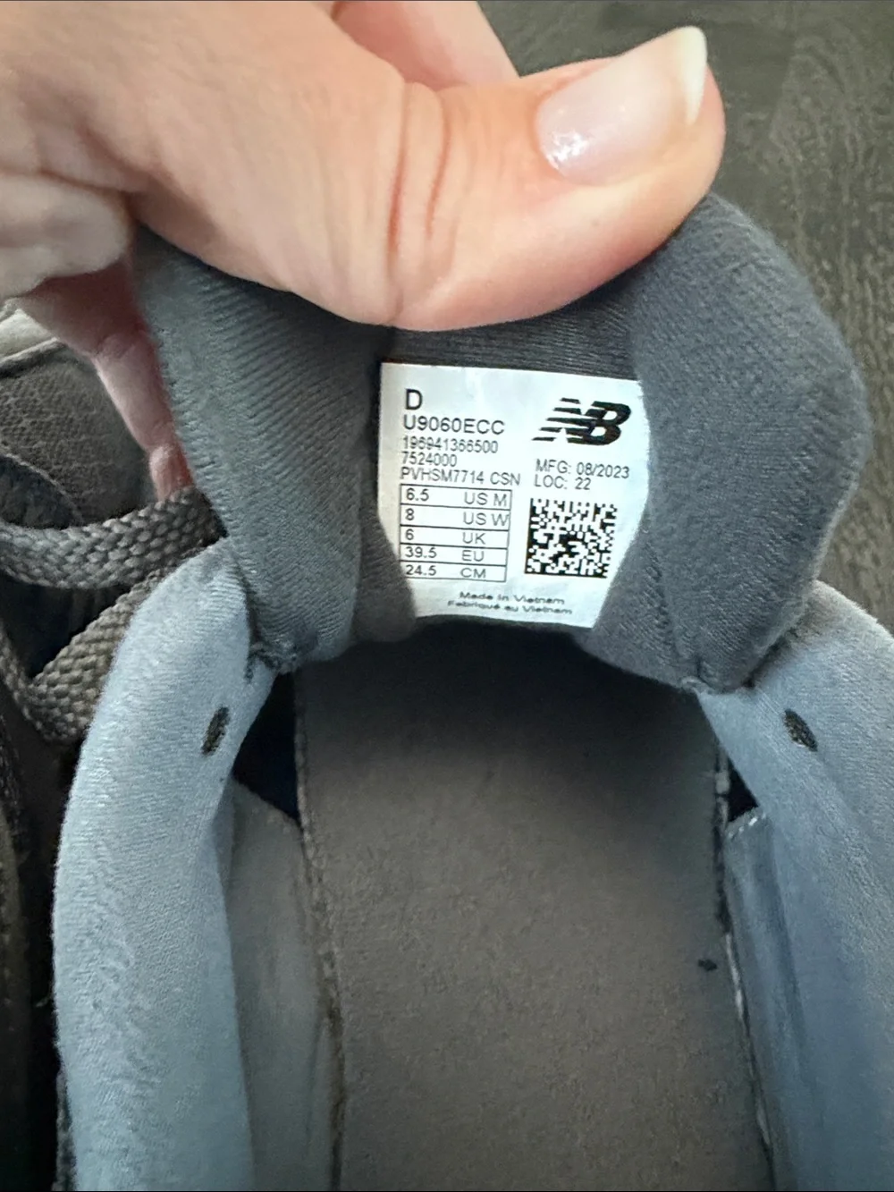 New Balance 9060 Gray Sneakers with Blue Logo Accents